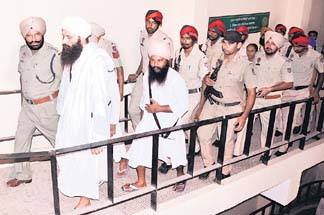 Baba Baljeet Singh Daduwal in police custody.