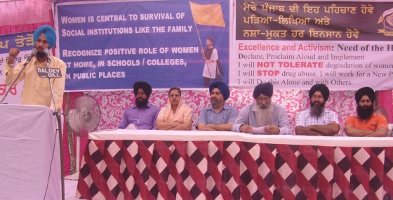 Youth activist Sukhvinder Singh addressing the conference. Seen in the pic are Kiranjot Kaur and others