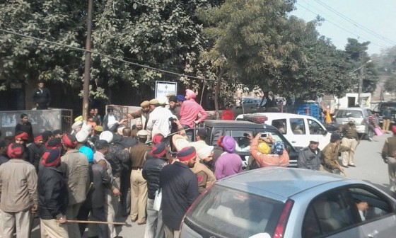 Sikhs being arrested by the police for preventing Shiv Sena activist from burning images of Sikh martyrs
