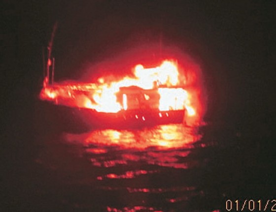 Pakistani fishing boad on fire before it sank