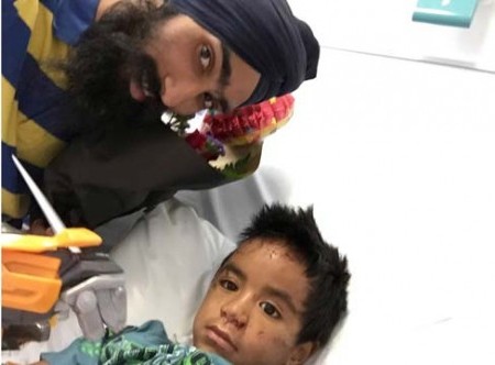 Harman Singh pictured with injured boy Daejon Pahia