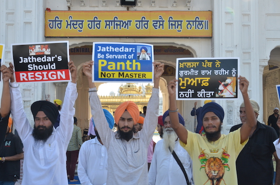 Sikh youth activists holding placards during the demonstration