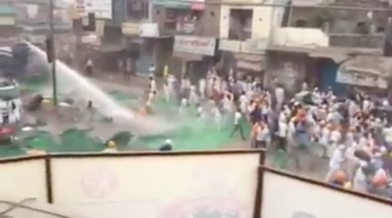 A still of police action against the Sikh sangat at Kotkapura