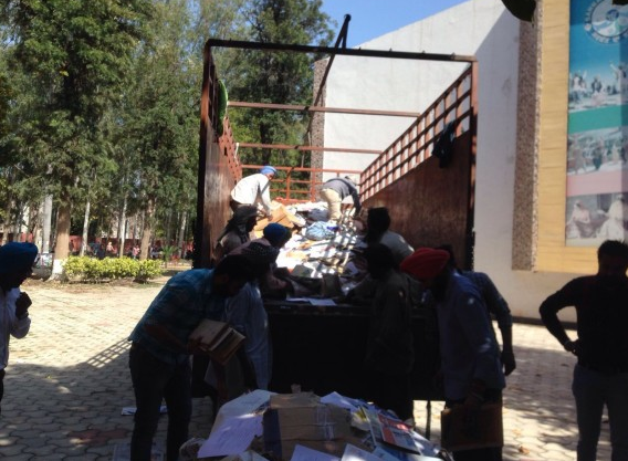 Documents being unloaded from the truck of scrap collector