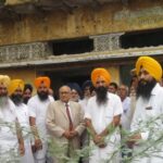 Justice T. K. Garg at site of Hondh Massacre (1984)